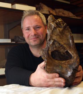 Me with the holotype dorsal vertebra of Xenoposeidon